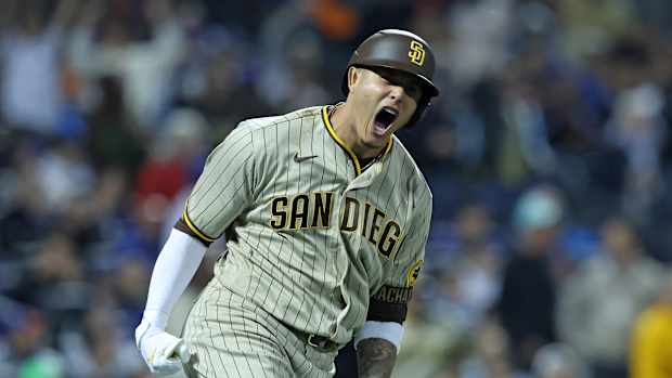 Manny Machado yells after hitting a home run.